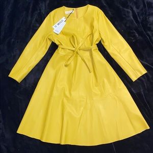 Leather! It says XL, after going to a seamstress, this is actually a size 8😞